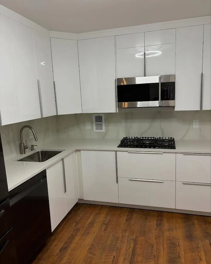 Restored kitchen with white cabinets after water damage in Byron